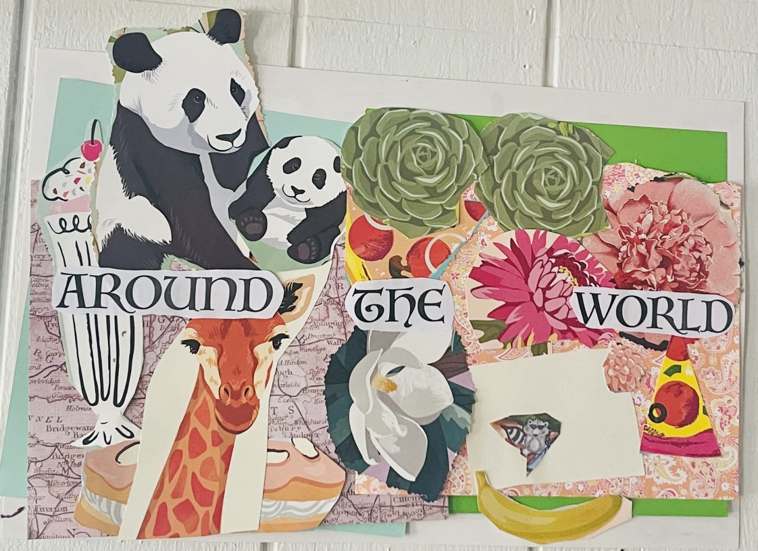 Paper collage titled Around the World with pandas, a giraffe, flowers, a banana and pizza